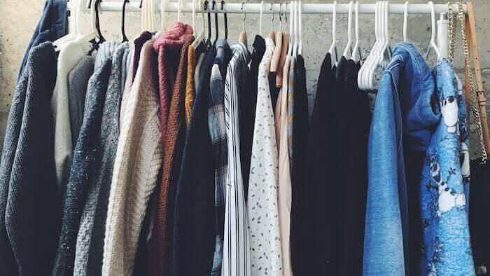 Clothes hanging up in a closet